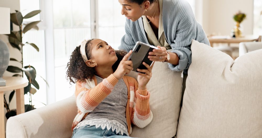 Phone, mother and home with discipline for child for limit of screen time for content exposure and cognitive development. Mom, girl and control or authority of cellphone for boundaries and parenting
