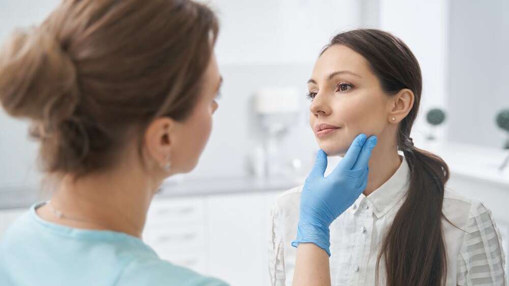 A female patient consulting to the cosmetic and dermatologist professional